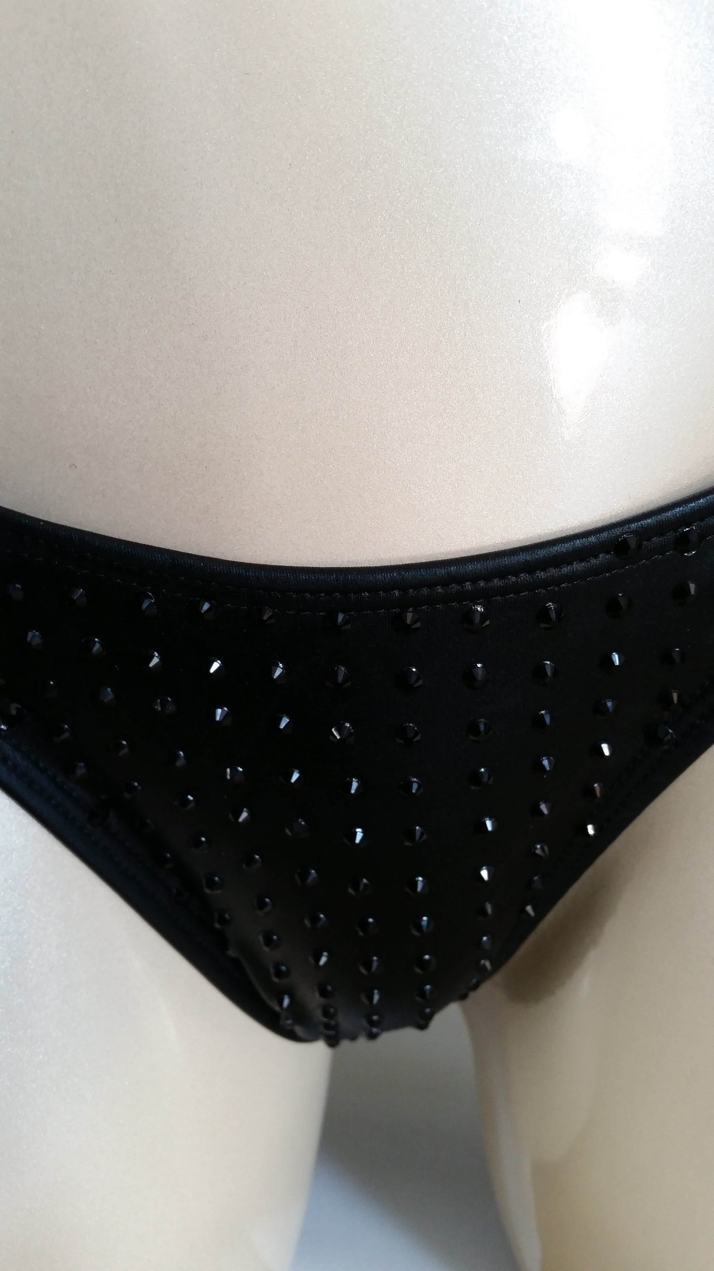 Black leather bikini with black rhinestone in a linear pattern design