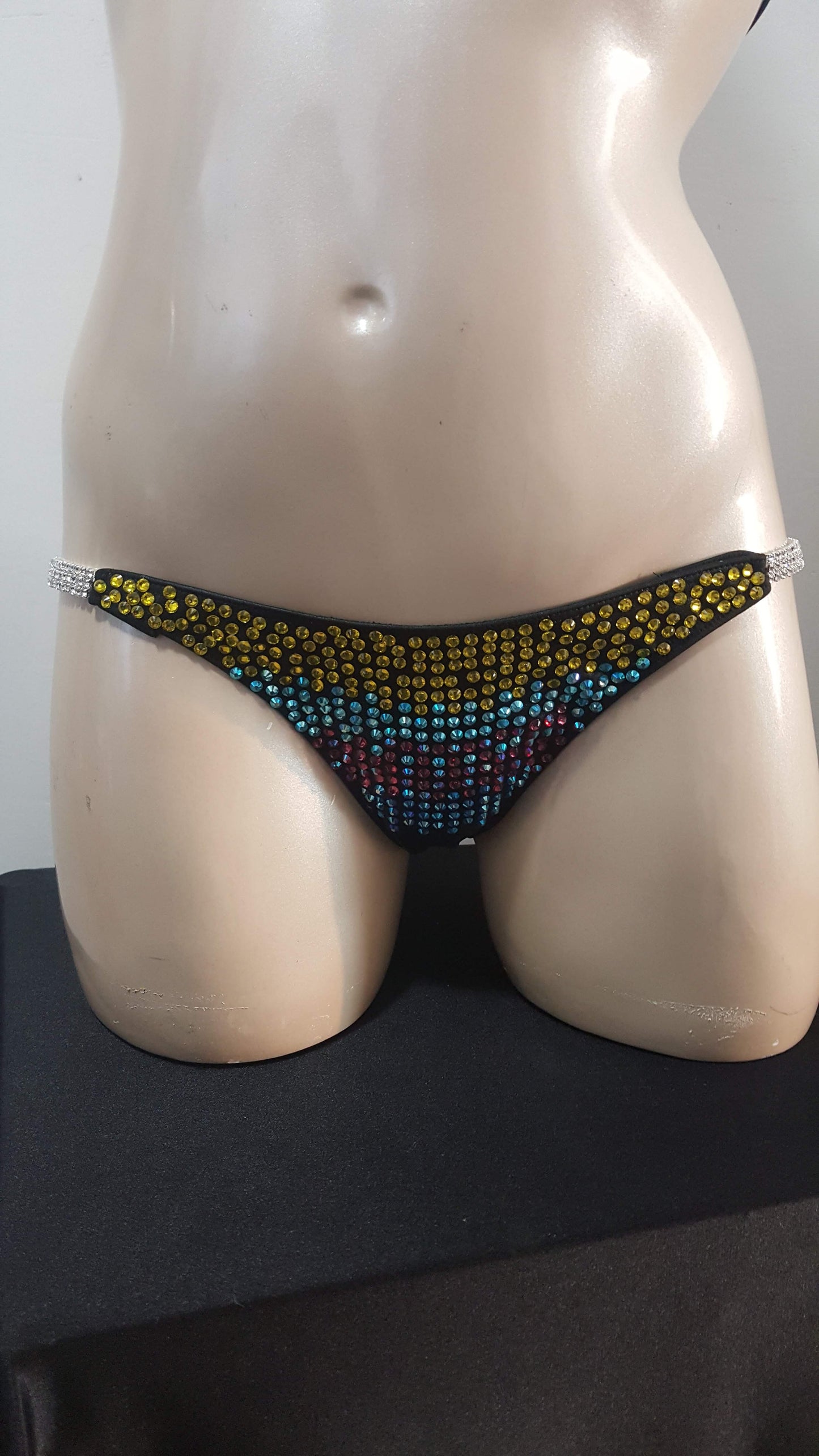 Black bikini with rainbow colored rhinestones design.