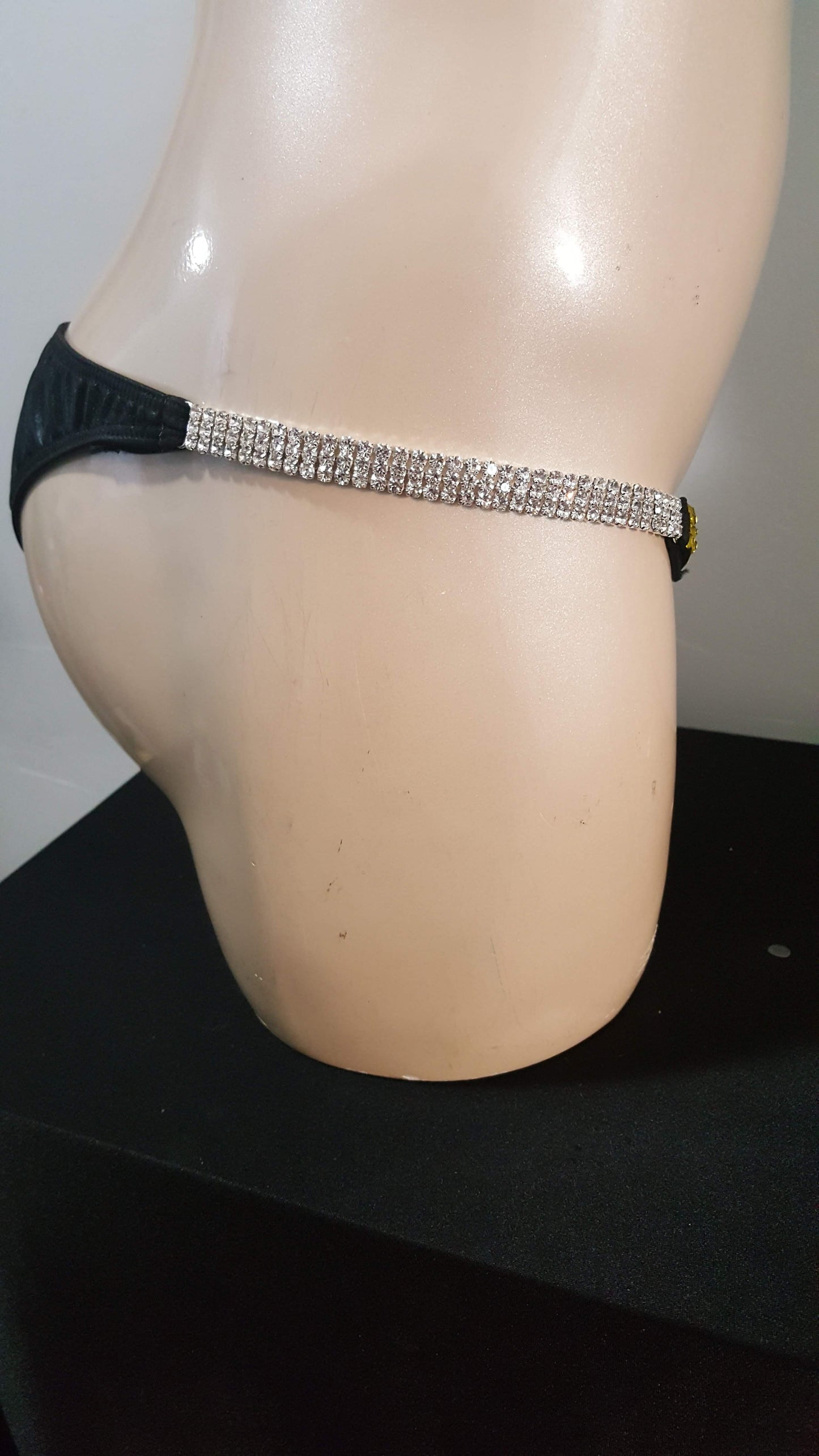 Black bikini with rainbow colored rhinestones design.